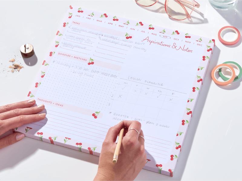 Cherry-bordered desktop calendar pad | Gartner Studios